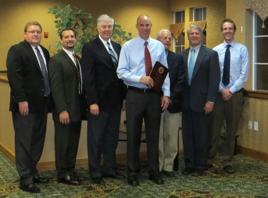 Utah's Best Insurance Agent for 2013, Aaron Griffith displays his award while surrounded by the states top insurance agents.